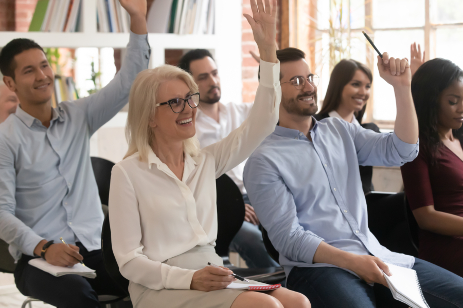 Motivated,Excited,Diverse,Employee,Raise,Hand,Taking,Part,In,Teambuilding